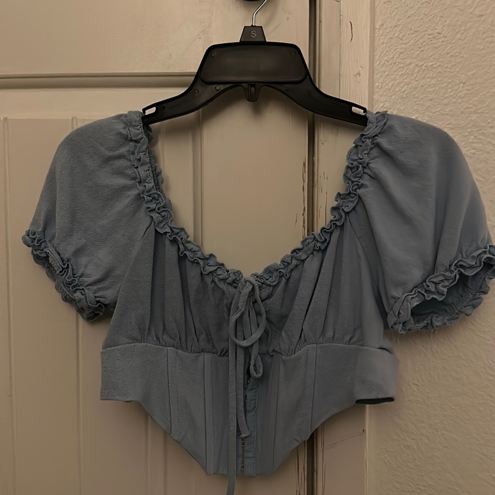 Blue corset crop top.